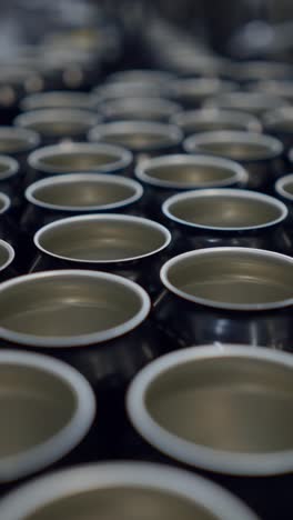 rows of empty metal cans in a factory