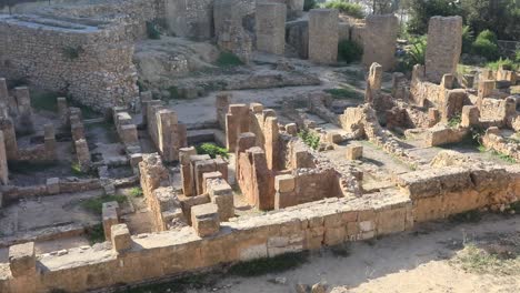 Sunny-day-over-ancient-Roman-ruins-in-Carthage,-Tunisia,-showcasing-historical-architecture