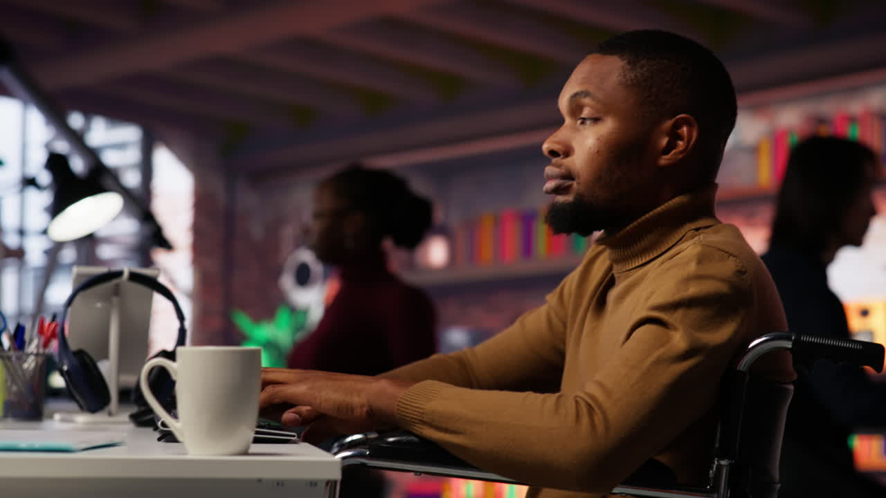 Man in wheelchair working in inclusive AI tech agency