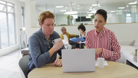 diverse group of male and female business colleagues working in office