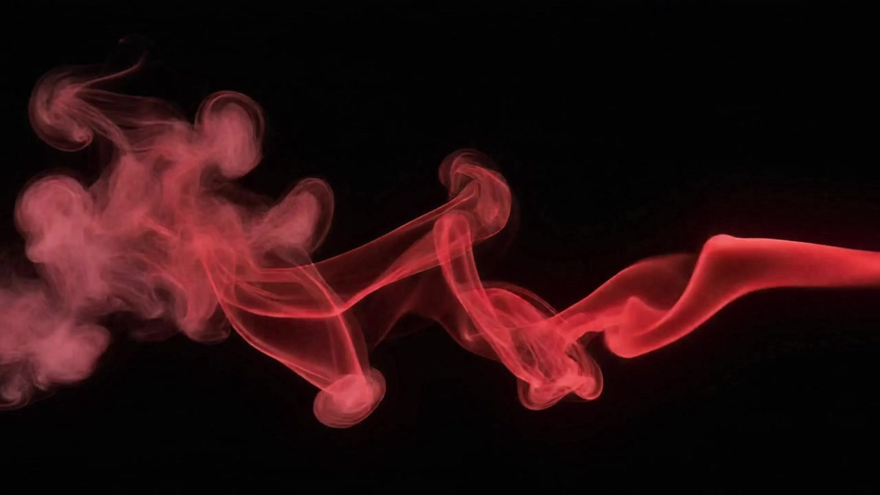 Fumo rosso astratto vorticoso su sfondo nero