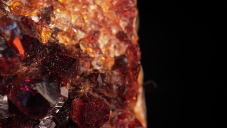 luminous detailed shot of the surface of golden citrine quartz crystal aglow against dark background