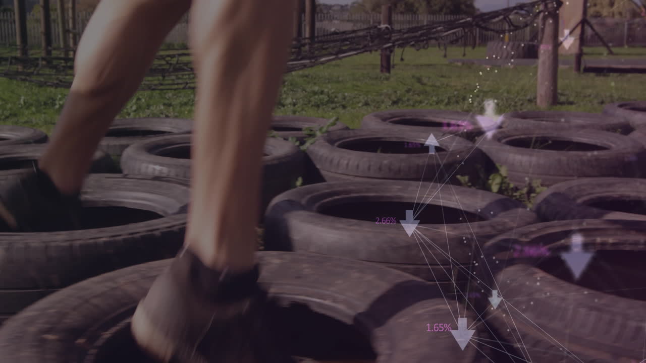 Running over tires, person with data processing animation overlay, training outdoors