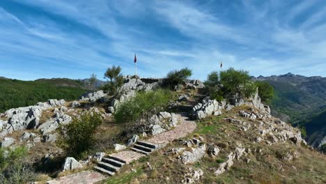 Hiking-trail-to-scenic-look-out-in-Valporquero,-Spain-with-cinematic-drone-flight-over-stairs-at-the-highest-point