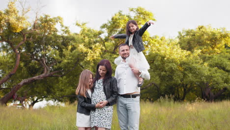 happy family portrait in a park