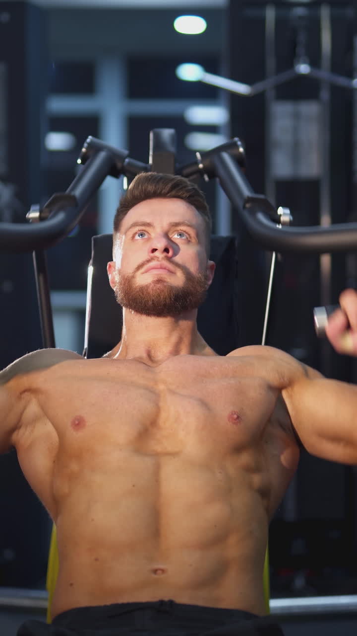 Man Working Out on Chest Press Machine