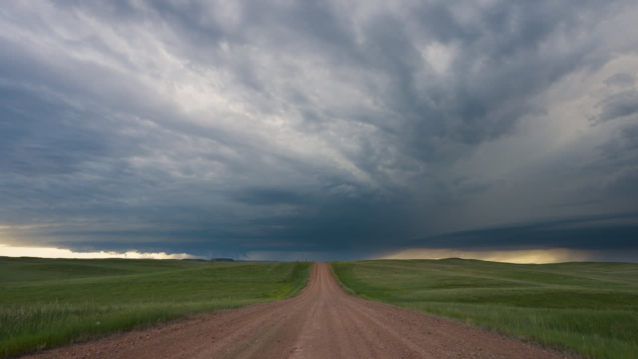 Distant Dark Storm Cloud Moving Across Quiet Country Side