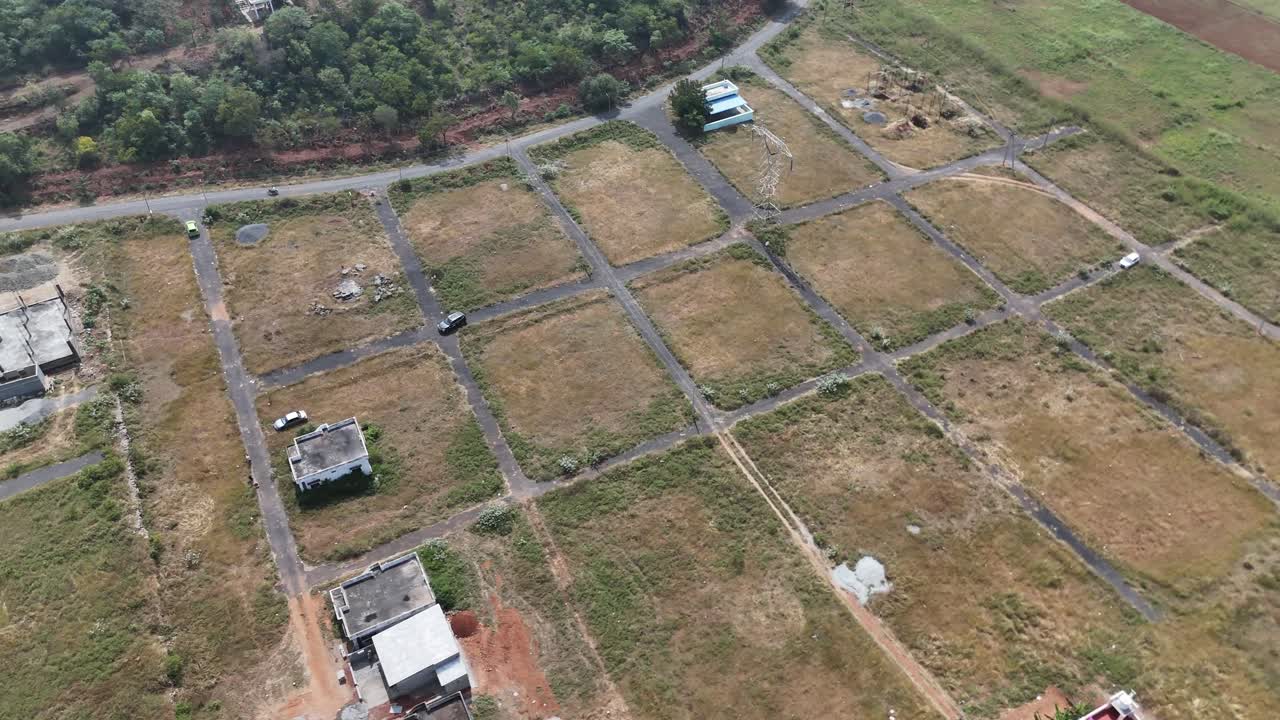 Dramatic aerial footage showcasing car passing through empty land