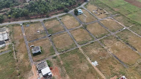 dramatic aerial footage showcasing car passing through empty land
