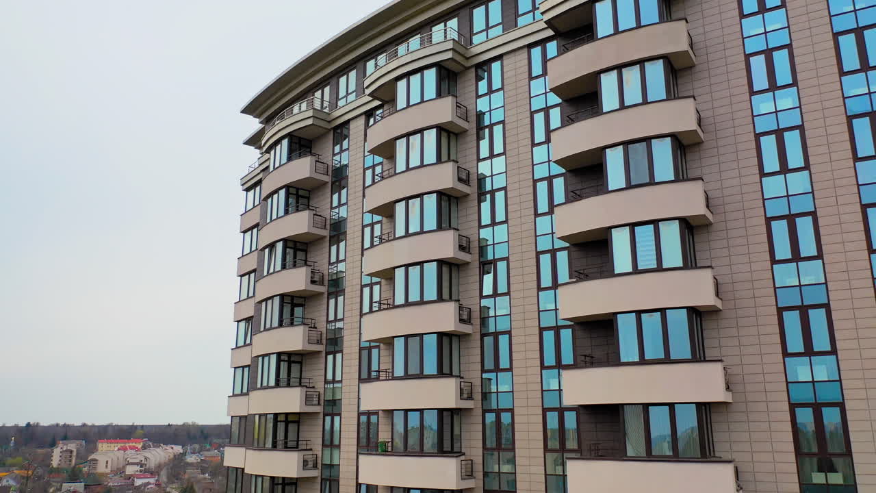 Typical apartment building in urban area. Aerial view of facade of modern high rise multi storey apartment building