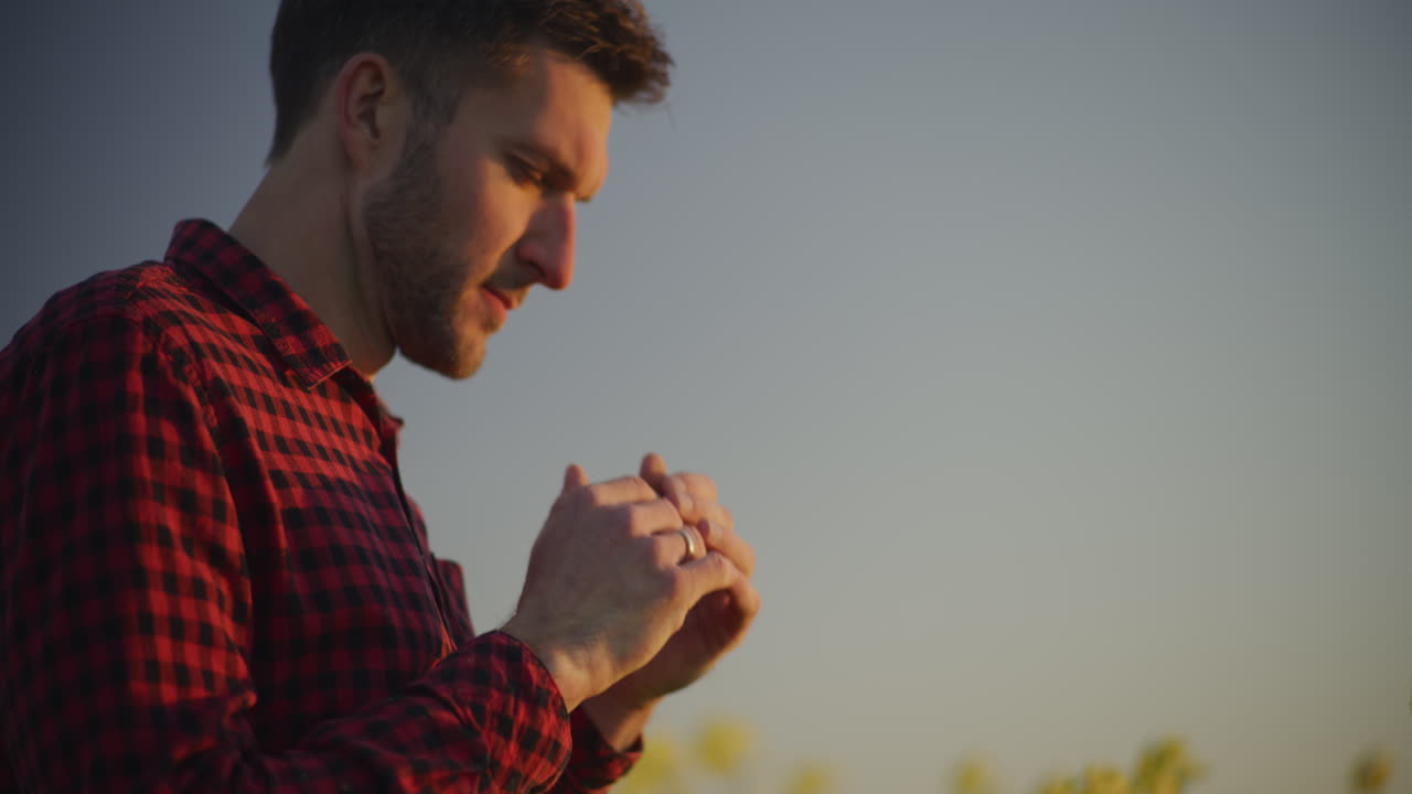 Pensive Farmer Looking at Agricultural Field