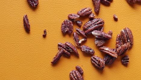 slow motion of dropping pecan-nut on table