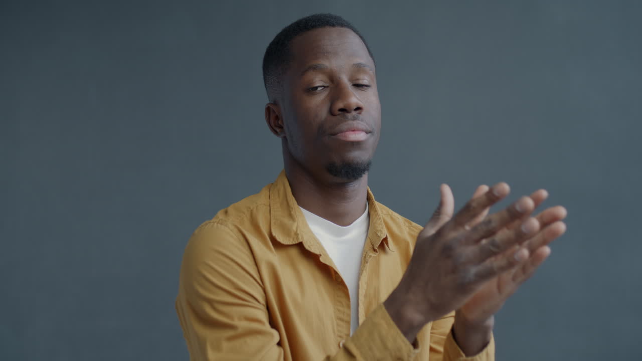 Man Clapping Hands in Studio