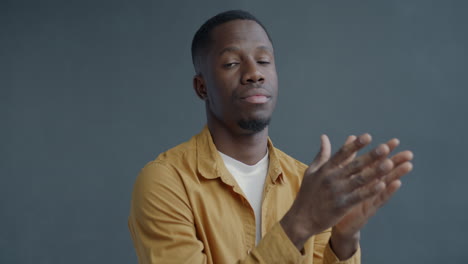 man clapping hands in studio