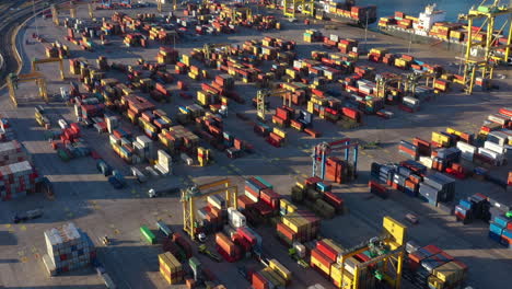 activity on the loading dock port of valencia trucks and containers docking work