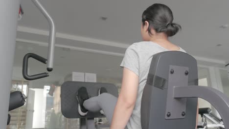 asian woman fitness asian woman working out on various fitness equipment fitness equipment