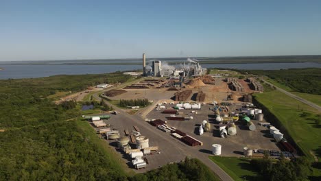 paper mill factory in front of uruguay river at fray bentos