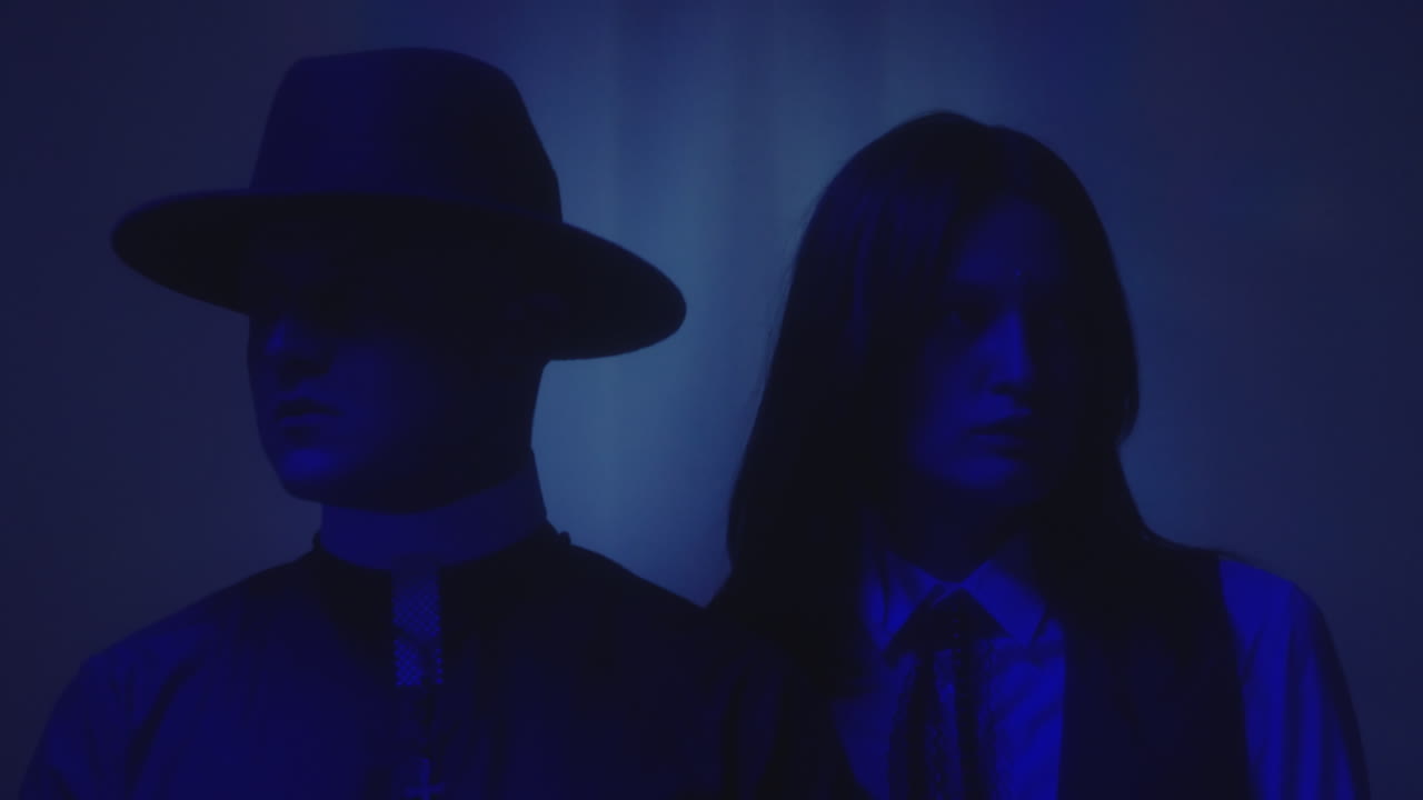 Priest and Preppy Girl In Neon Light