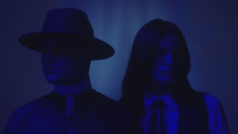 priest and preppy girl in neon light