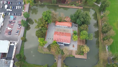 town hall surrounded by moat aerial tilt high angle