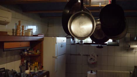 a shot showing a rural kitchen into a typical old farm in spain