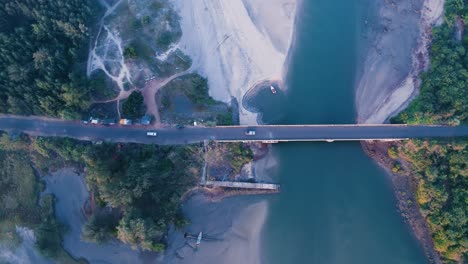 aerial view of seaside bridge and vehicles