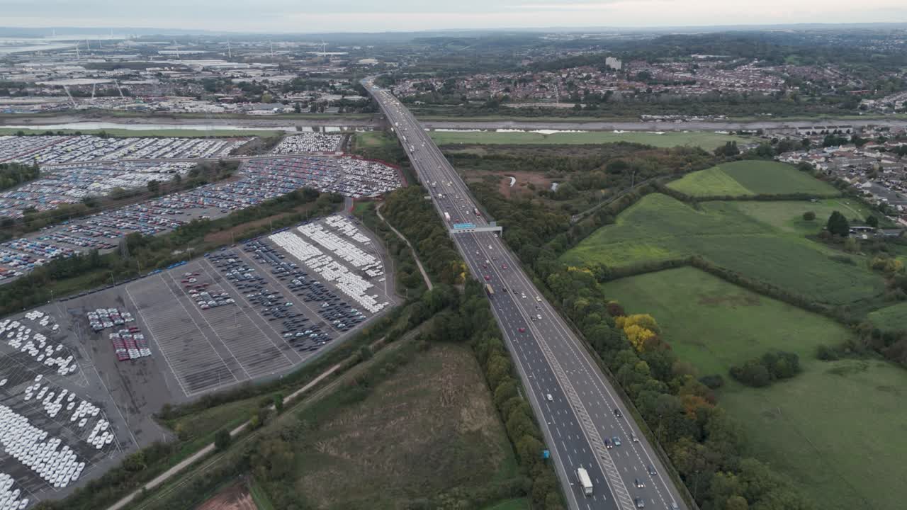 Sweeping aerial view of M5 motorway bridge spanning River Avon, featuring surrounding landscape and transport infrastructure, Bristol, UK