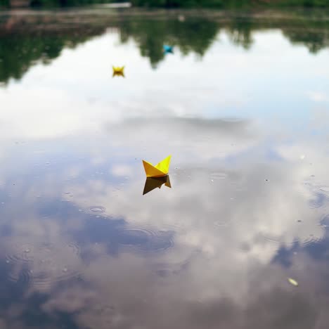 paper boat is floating on the water