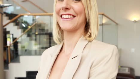 businesswoman standing with arms crossed in office 4k