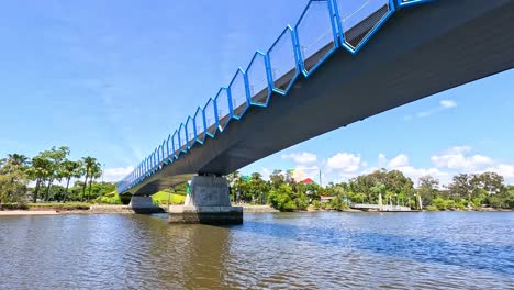 a bridge spans a calm river scene