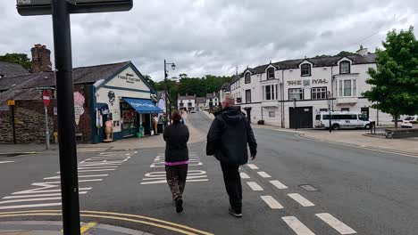 a couple walking across a street