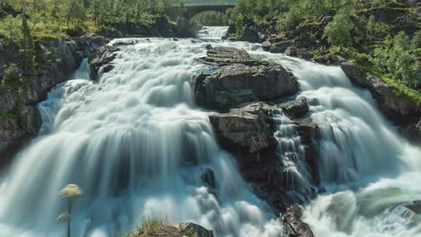 long exposure time lapse of waterfall in scenic landscape