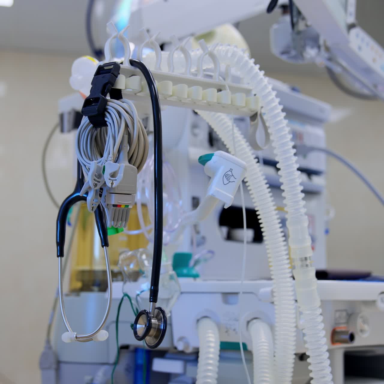Parts and components of devices in surgical room. Artificial lung ventilation machine at backdrop. Blurred background