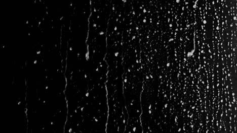 liquid drops of water on a glossy surface (looping, alpha channel)