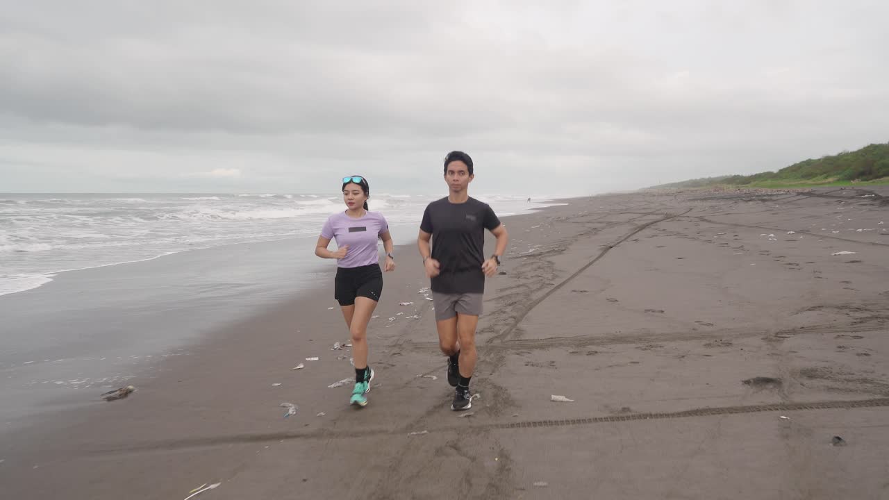 Couple Running on a Beach