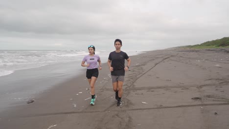couple running on a beach