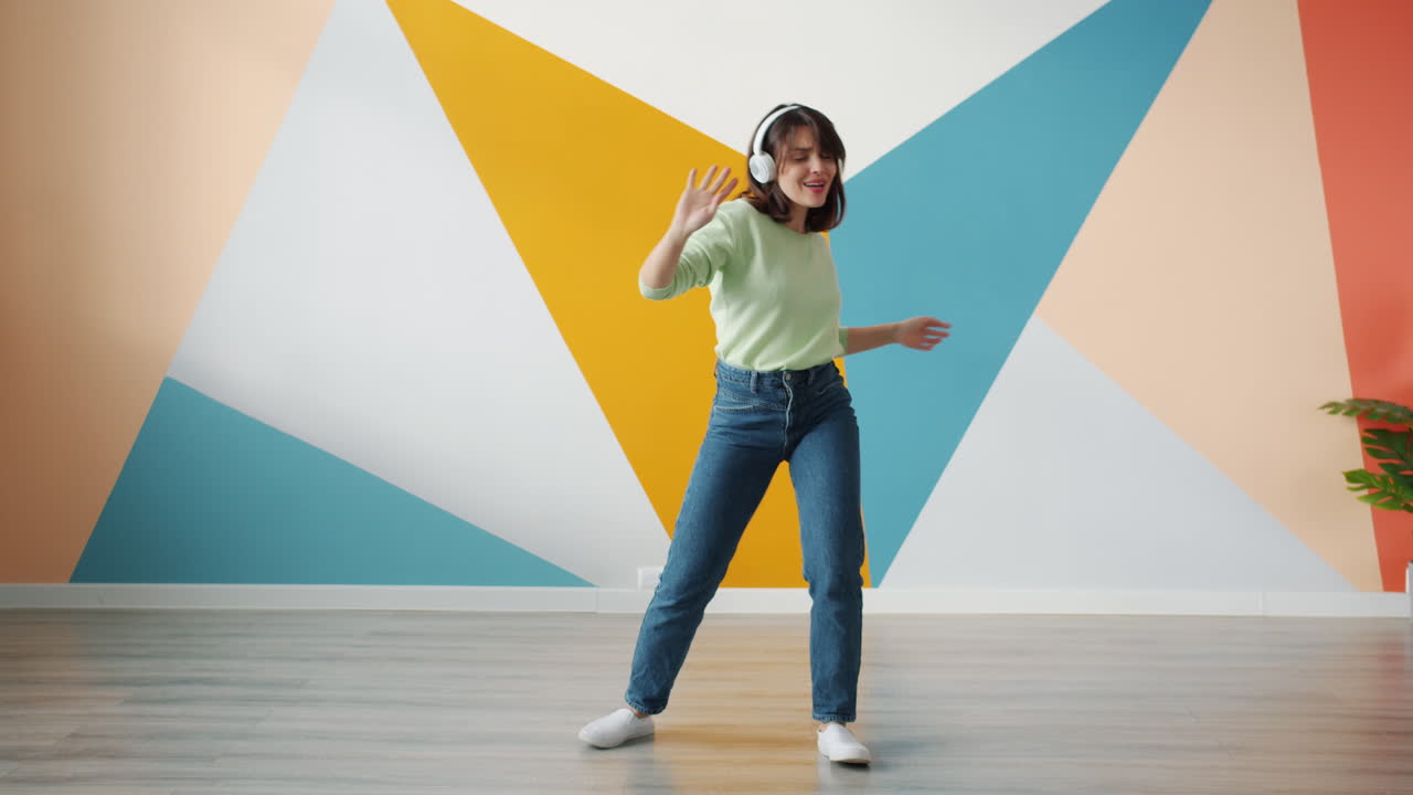 Woman Dancing to Music at Home