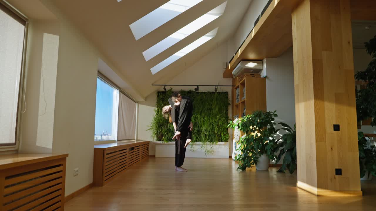 Couple Dancing in a Room with a Green Wall