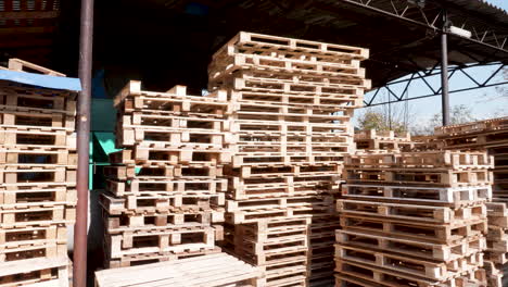 warehouse with stacked wooden pallets ready for distribution