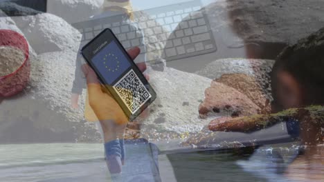 Animation-Einer-Kaukasischen-Frau-Mit-Smartphone-über-Einer-Kaukasischen-Frau-Am-Strand