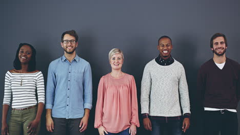 group of people pointing upwards, full of enthusiasm