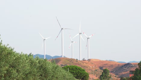 wind turbine construction in field and meadow on hill,clean energy concept, calabria , italy