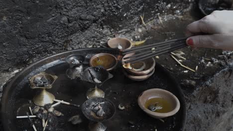 devotee offering the incense sticks at temple at day