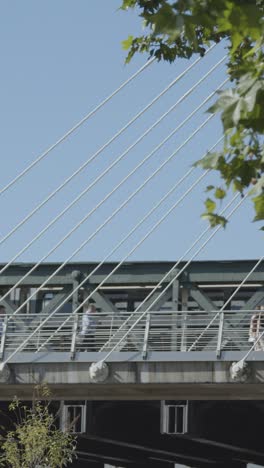 vertical video commuters hungerford charing cross bridge in london