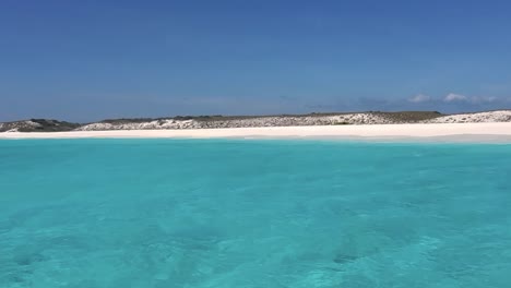 sail on turquoise sea toward cayo de agua lighthouse island, texture water