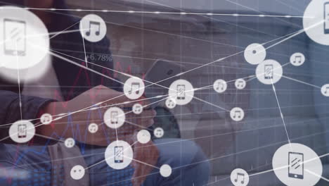 Animation-of-connected-icons,-graphs-with-changing-numbers,-biracial-man-using-smartphone