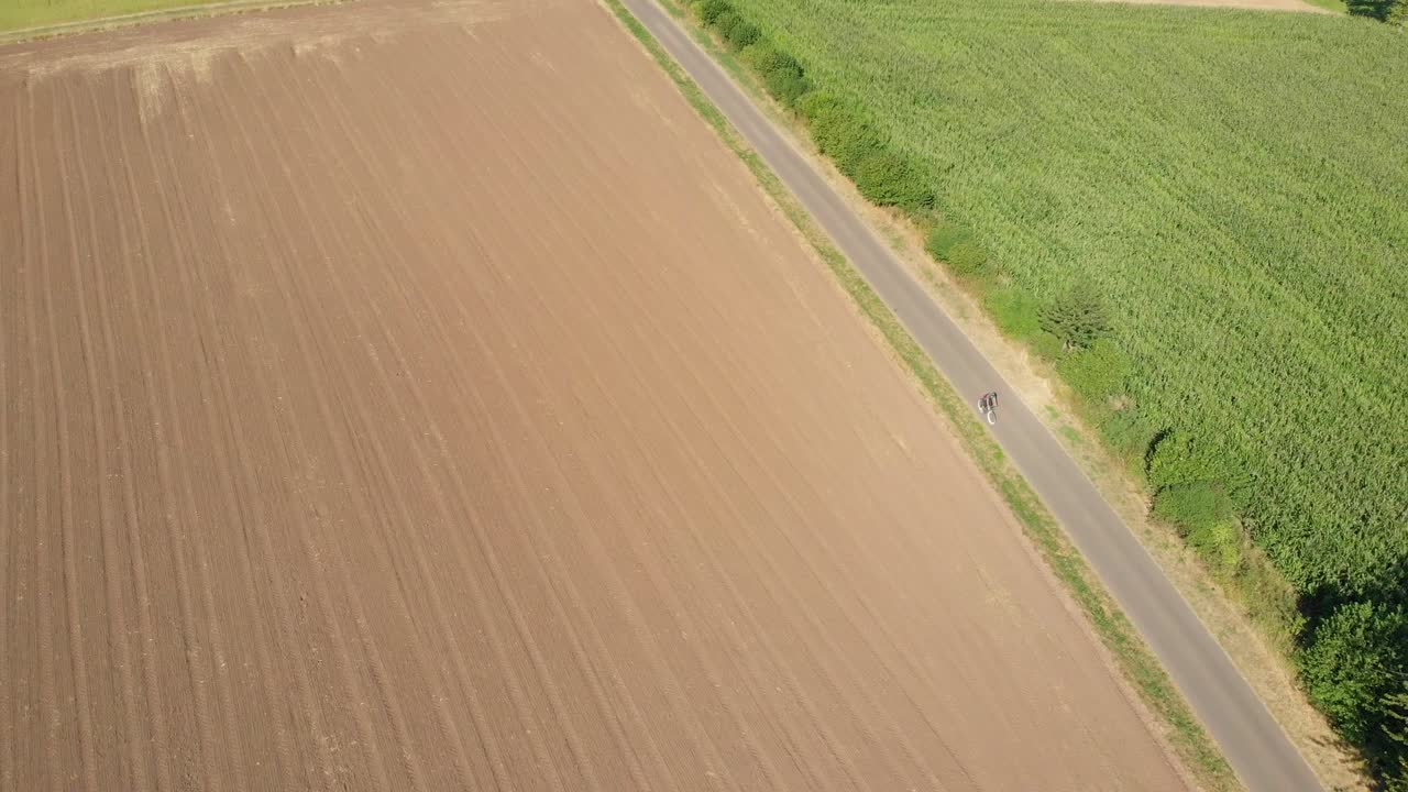 Cyclist riding a bike through the countryside