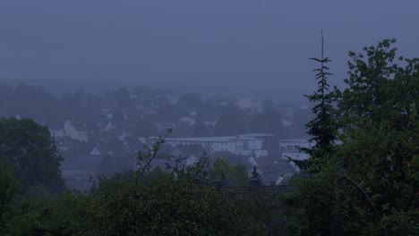 Witness-a-dramatic-scene-of-heavy-rain-and-lightning-striking-a-small-family-village-in-Germany