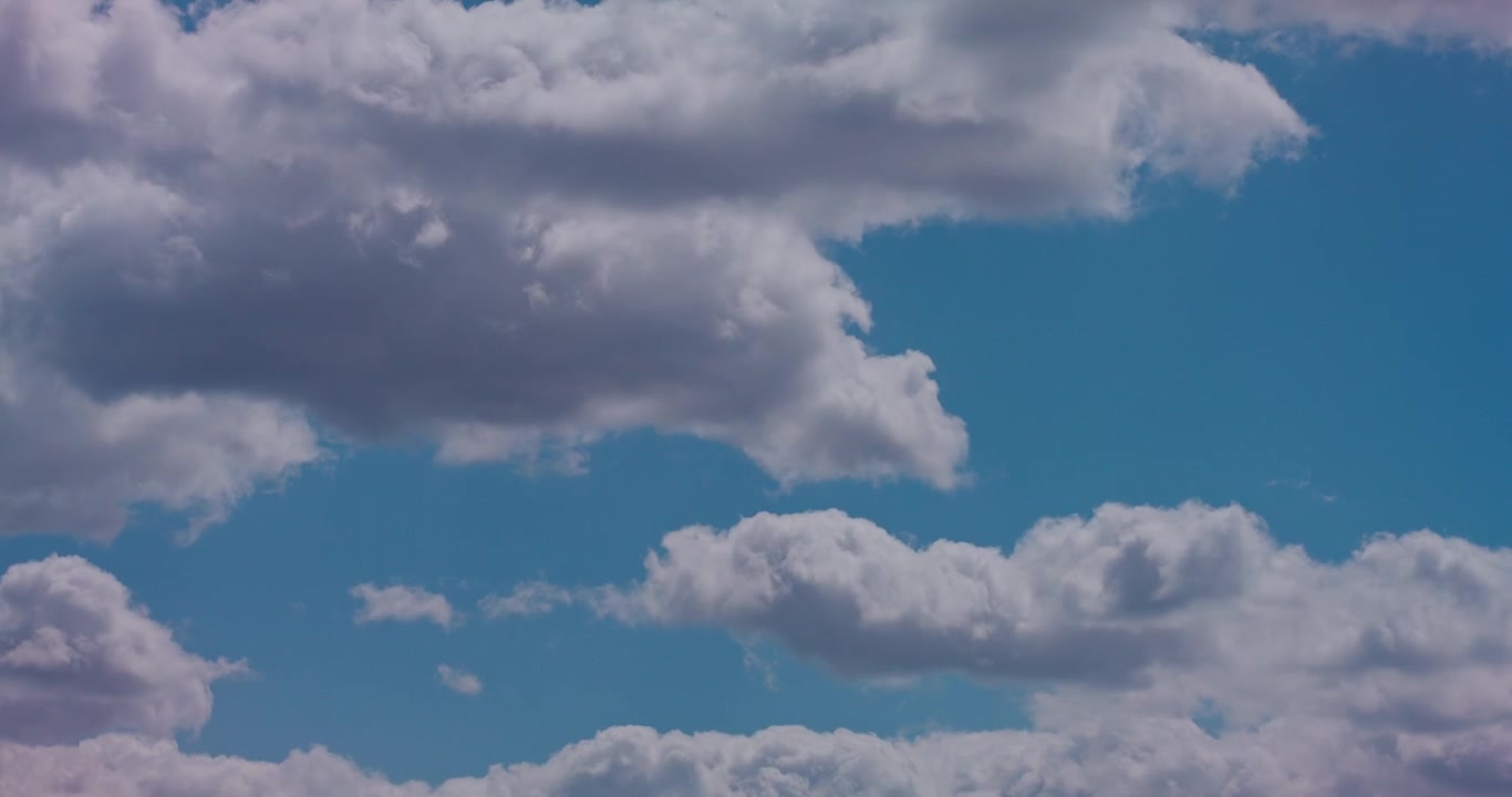 Time-Lapse of White Clouds Moving Across a Blue Sky