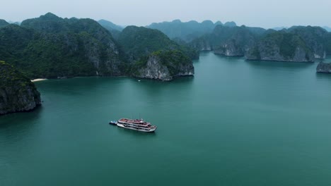 Captivating-Aerial-Views-of-Ha-Long-Bay:-Serene-Waters,-Rocky-Islands-and-Cruise-ships